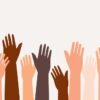 10 hands of various skin tones raised up